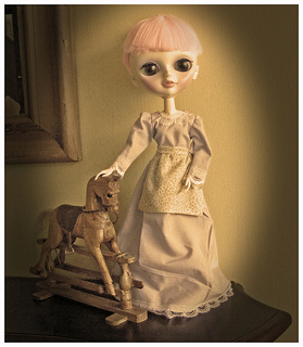 Frontier Dress Sepia Sepia photo of doll dressed in frontier-style dress with rocking horse