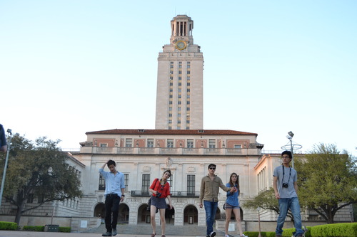 UT tower students posing in front of UT tower