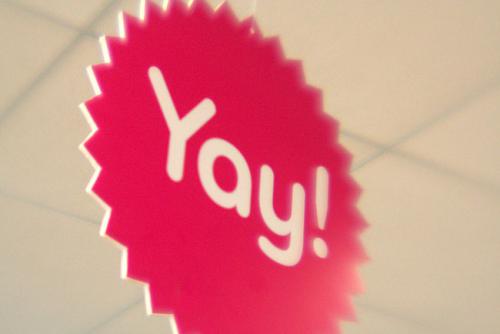 Yay Sign Photo of red, sun-shaped sign with the word Yay!